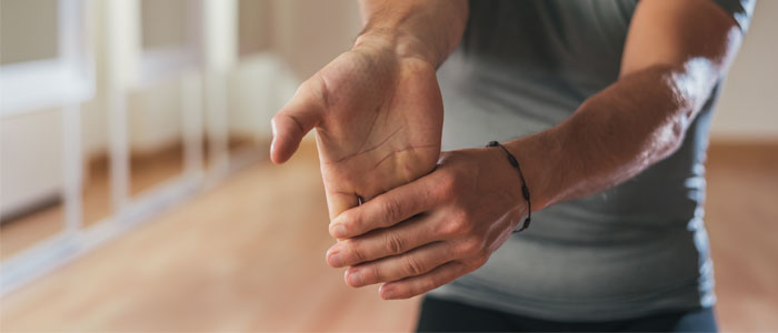 Person doing wrist stretch