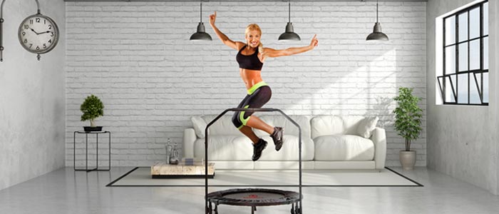 Woman using a Marcy fitness trampoline in her living room