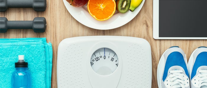 Scales for weight management, and water bottle/trainers for health and fitness