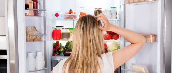 woman looking in the fridge 