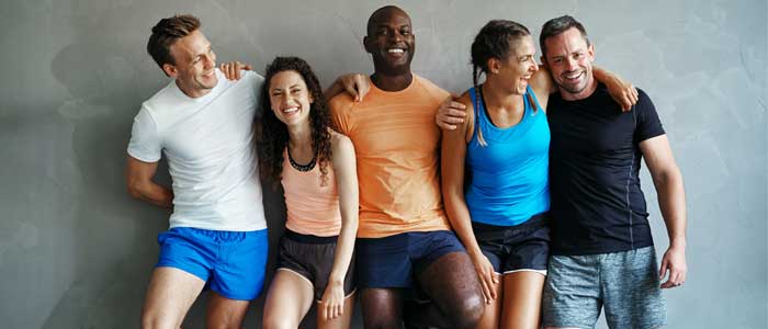 Group of fitness people laughing