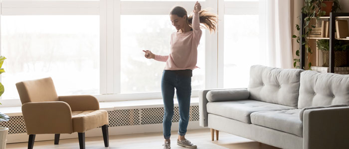 woman dancing in the living room