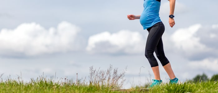 a pregnant woman jogging