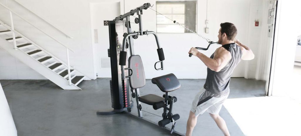 Man working out on a Marcy multi gym