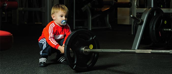 Child racking a barbell