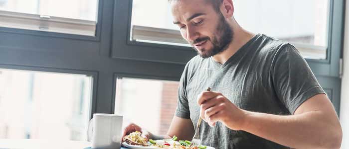 Man eating with intermittent fasting in place